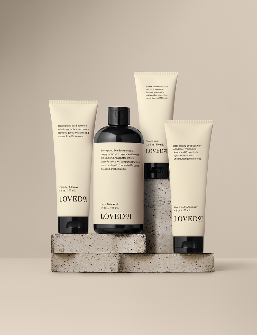 Product collection image with a tan background. The image shows the Exfoliating Cleanser, Shave Cream, Face+Body Wash and Face+Body Moisturizer.