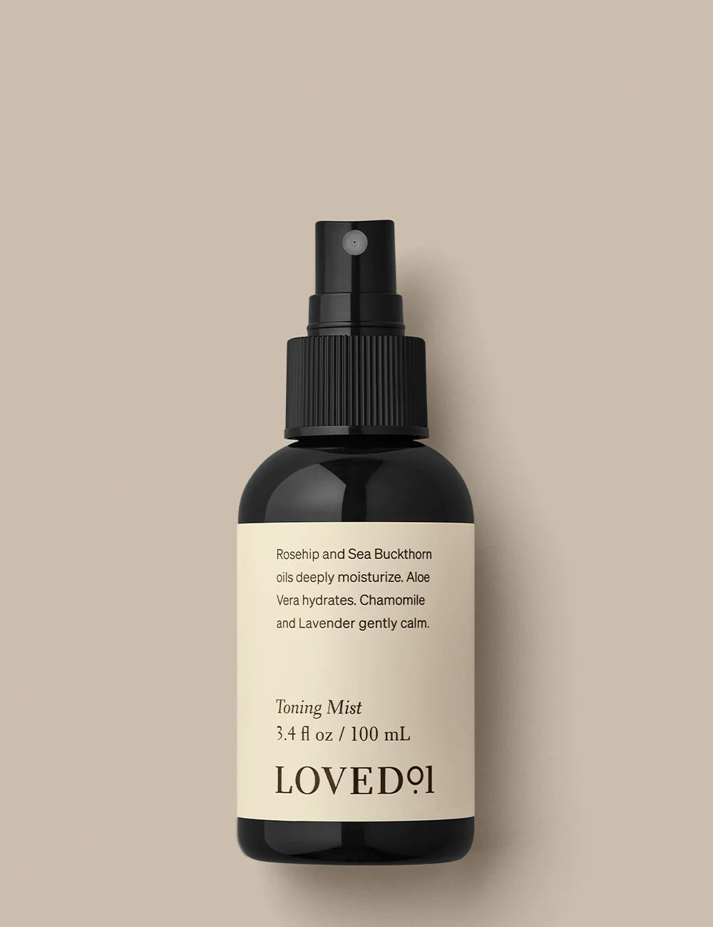 Product image with a tan background. The image shows the Toning Mist.